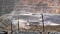 Workers use machinery to dig at a rare earth mine in Baiyunebo mining district of Baotou in north China's Inner Mongolia Autonomous Region, 2010.