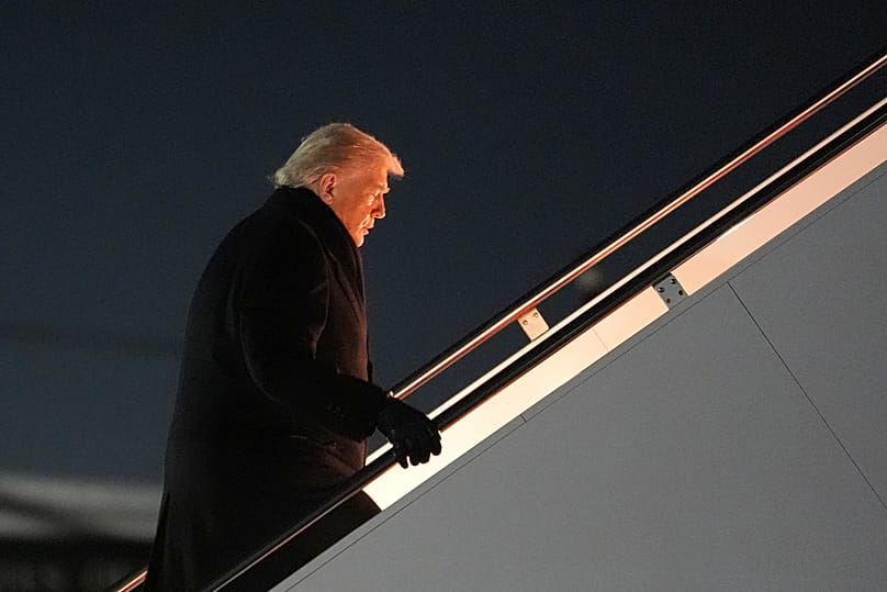 US President Donald Trump boards Air Force One for a trip to attend the World Economic Form in Davos, 20 January, 2026