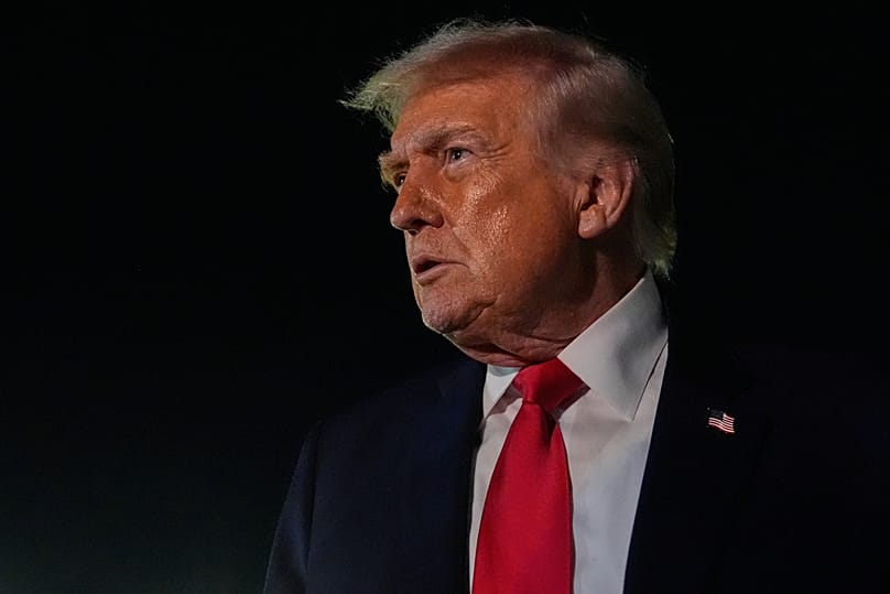 President Donald Trump speaks to reporters before boarding Air Force One at Palm Beach International Airport, Monday, Jan. 19, 2026, in West Palm Beach, Fla.