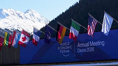 World flags are pictured against a backdrop of the Swiss Alps during the World Economic Forum in Davos, 20 January 2026