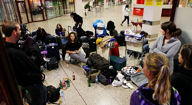 Passengers sit next to their luggage as flights were cancelled after a Boeing 767 of Polish LOT airlines made an emergency landing in Warsaw, Poland, Nov. 1, 2011.