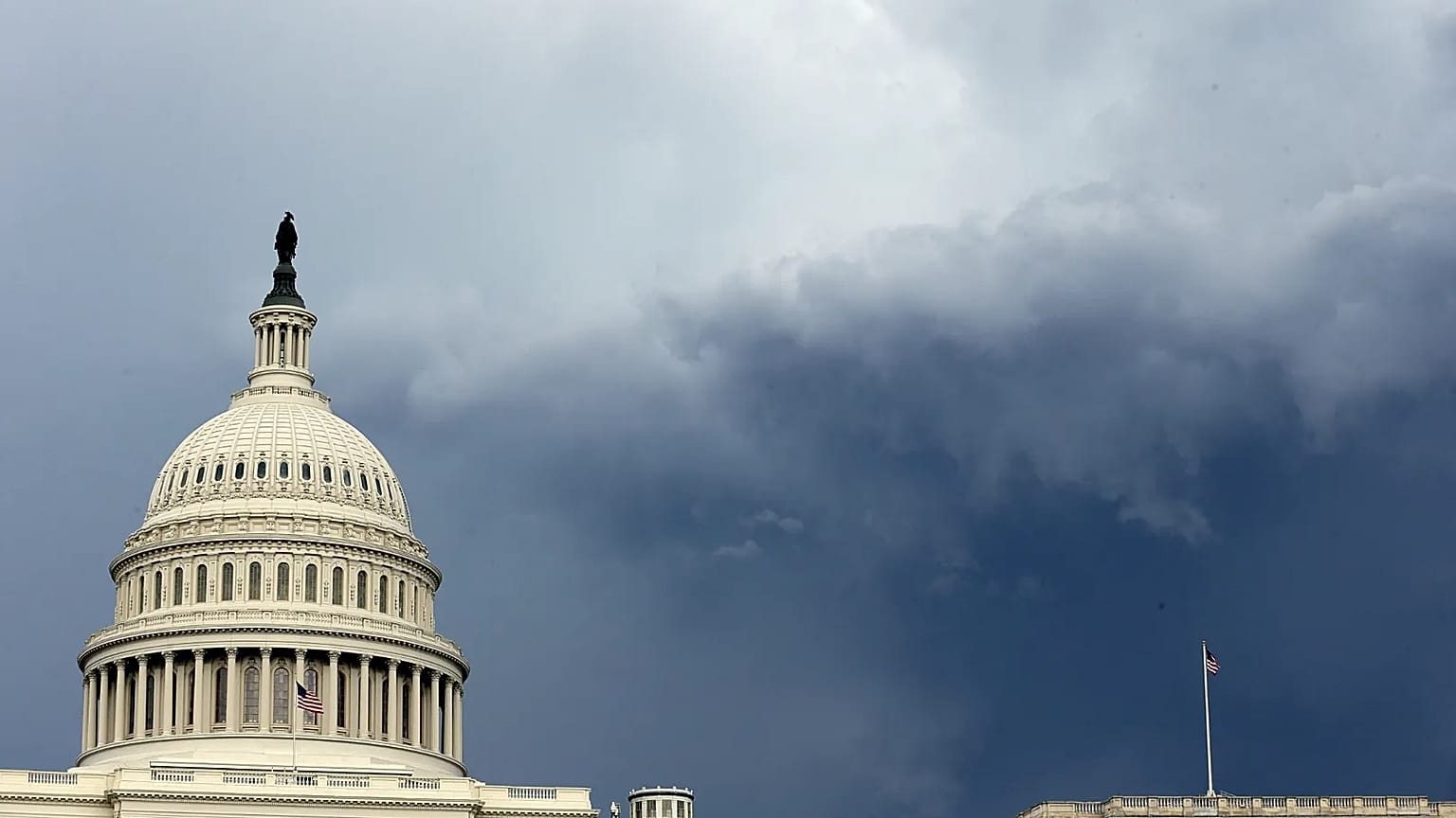 Dark clouds are seen behind the US Capitol as a storm moves through Washington, DC.