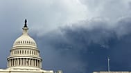 Dark clouds are seen behind the US Capitol as a storm moves through Washington, DC.