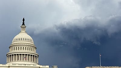 Dark clouds are seen behind the US Capitol as a storm moves through Washington, DC.