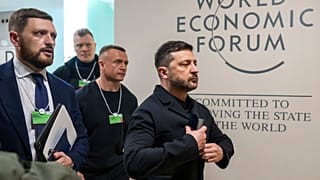 Ukraine's President Volodymyr Zelenskyy, right, arrives for the Annual Meeting of the World Economic Forum in Davos, Switzerland, Jan. 22, 2026. 