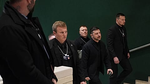 Ukraine's President Volodymyr Zelenskyy walks up a stairwell as he arrives for the Annual Meeting of the World Economic Forum in Davos, 22 January 2026