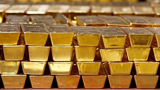Gold bars are stacked in a vault at the United States Mint, 22 July, 2014