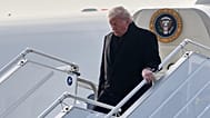 President Donald Trump steps off Air Force One after arriving at Zurich International Airport for the World Economic Forum. 21 January 2026