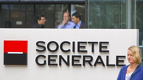 FILE - In this 11 August 2011 file photo, employees stand at the entrance of the Societe General bank headquarters in Paris.