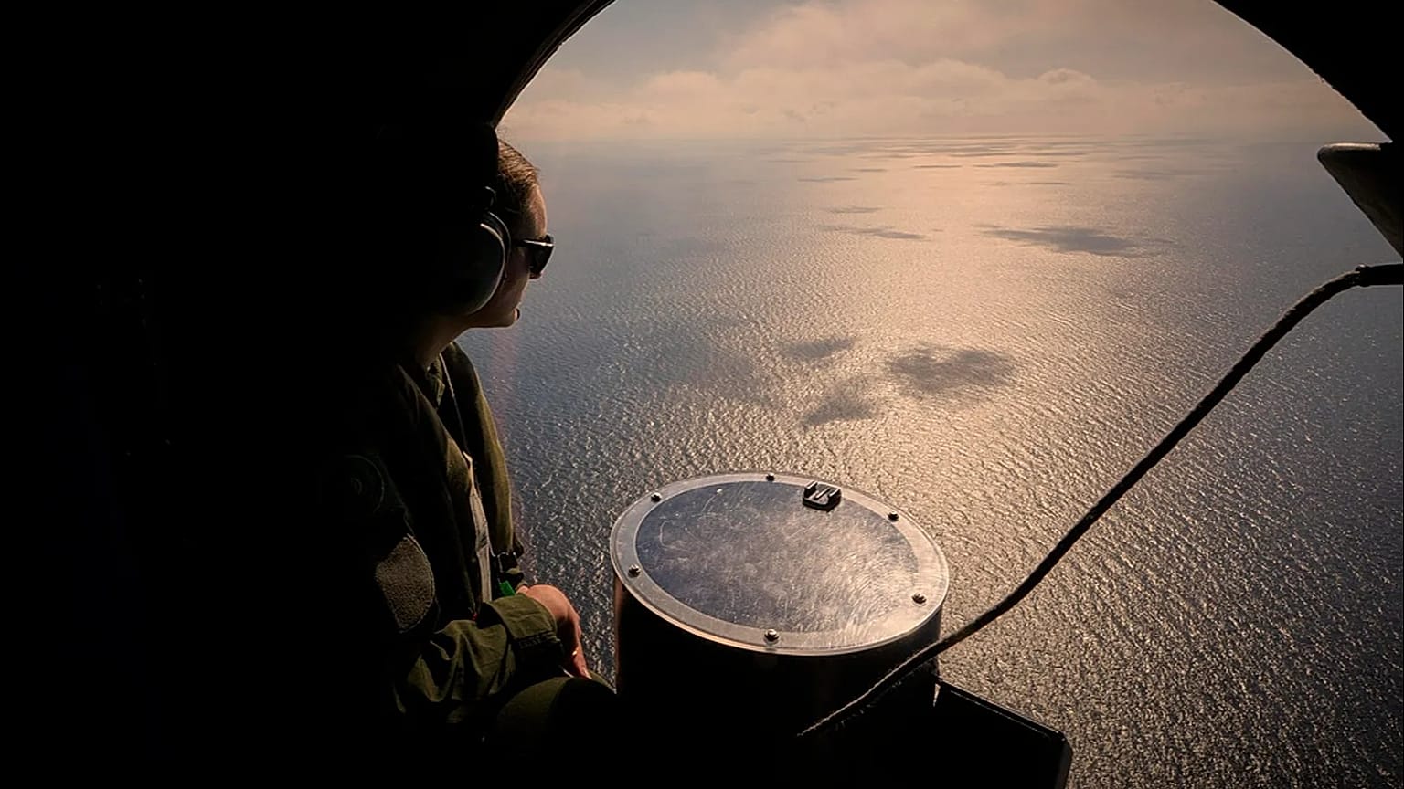 A crew member of a French Navy Atlantique-2 submarine hunter naval airplane near the Black Sea port of Constanta, 9 April, 2025