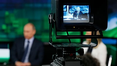  In this Tuesday, June 11, 2013 file photo, Russian President Vladimir Putin is shown on the screen of a camera viewfinder at the new headquarters of "Russia Today" television