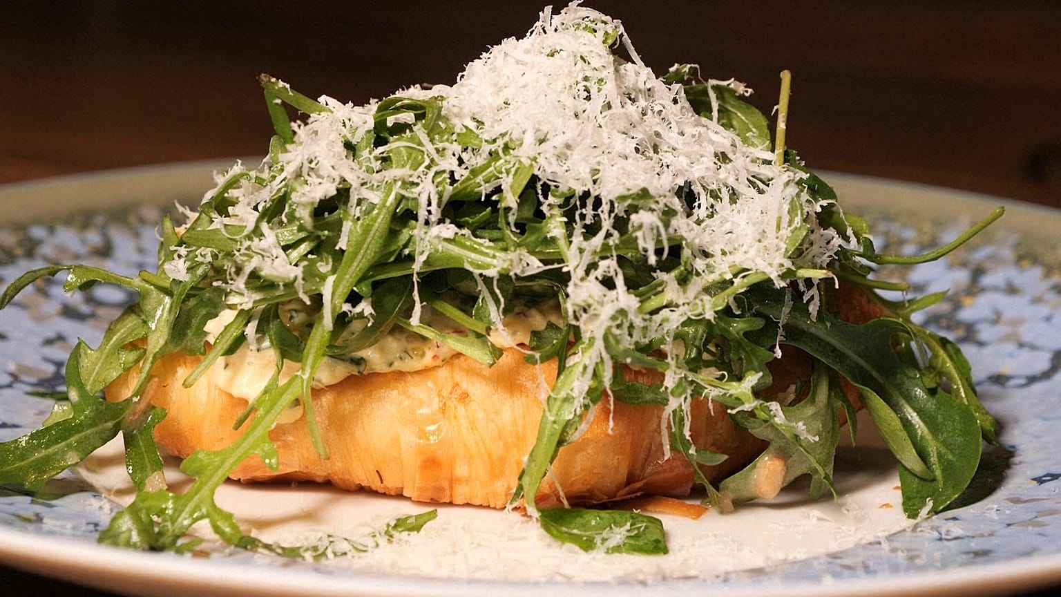 A croissant base, with lobster, poached egg, rocket and shaved Parmesan served at Pavyllon restaurant in London.