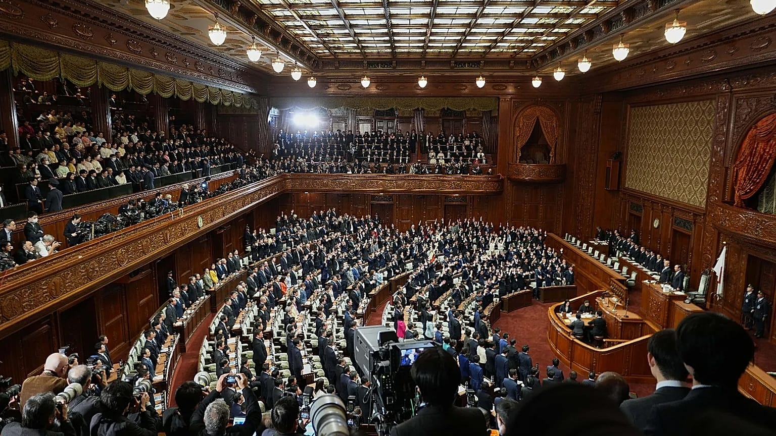 Lawmakers stand after dissolving the lower house of parliament in Tokyo, 23 January, 2026