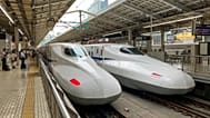 Two white bullet trains in a station in Tokyo, Japan