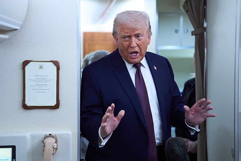 US President Donald Trump speaks with reporters aboard Air Force One after leaving the World Economic Forum in Davos, 22 January, 2026