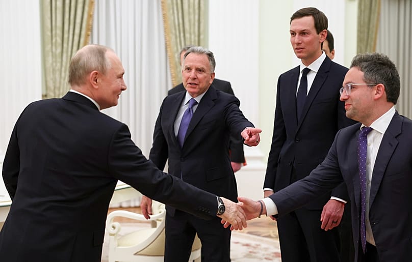 Russian President Vladimir Putin, greets Steve Witkoff, Jared Kushner, second right, and Josh Gruenbaum,,  in Moscow, Thursday, Jan. 22, 2026. 