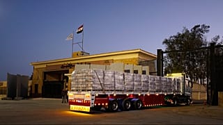 A truck with humanitarian aid at the Egyptian gate of the Rafah crossing, before entering Gaza Strip, Monday, Oct. 20, 2025.