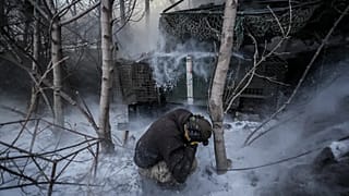 Servicemen fire a 2S1 Gvozdika self propelled howitzer towards Russian positions near Chasiv Yar town, 18 January, 2026