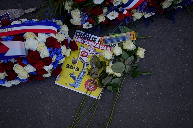 Wreaths are placed in front of Charlie Hebdo's former offices during commemorations marking 10 years since an Islamist attack in Paris, 7 January, 2025