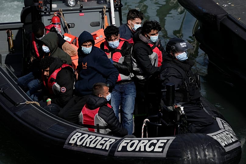 People thought to be migrants who undertook the crossing from France in small boats and were picked up in the Channel arrive in Dover, 17 June, 2022