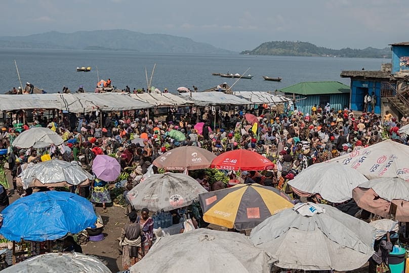 People gather at the Kituku market on the shores of Lake Kivu in Goma, Democratic Republic of the Congo, Monday, Jan. 26, 2026, a year after M23 took control of the city.