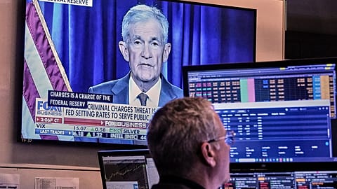FILE. A video of Federal Reserve Chair Jerome Powell plays on a screen on the floor of the New York Stock Exchange. 12 Jan. 2026.