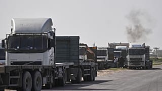 Aid trucks enter the Gaza Strip via the Rafah crossing with Egypt 