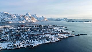 Houses are seen near the coast of a sea inlet of Nuuk, Greenland, on Sunday, Jan. 25, 2026. 