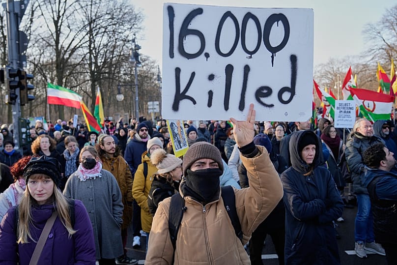 FILE: Protesters participate in a demonstration in support of the nationwide mass protests in Iran against the government, in Berlin, 18 January 2026