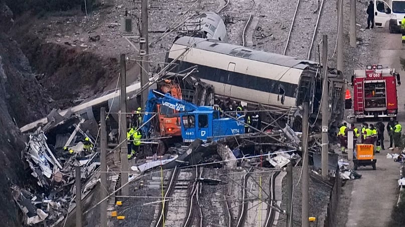 FILE: View of the site of a train collision in Adamuz, southern Spain, Tuesday, Jan. 20, 2026. 