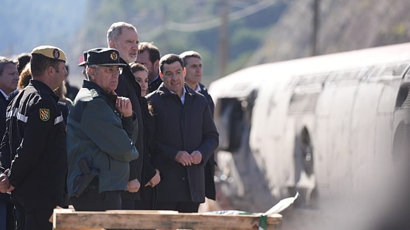 Spain's King Felipe VI and Queen Letizia visit the site of a train collision in Adamuz, southern Spain, Tuesday, Jan. 20, 2026.