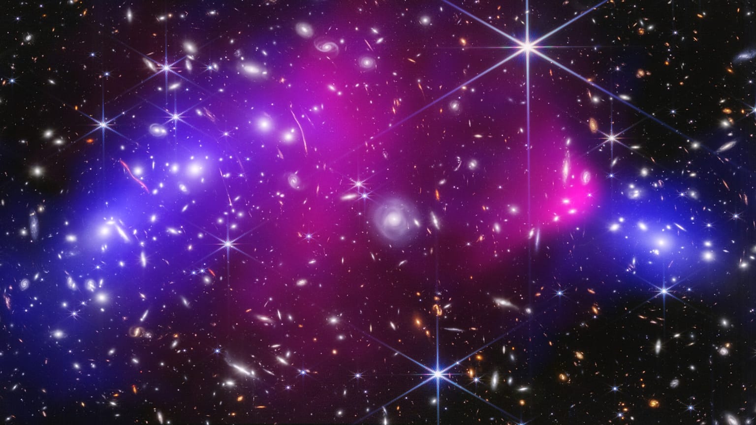 This NASA image shows two massive galaxy clusters previously captured by NASA's James Webb Space Telescope and Chandra X-ray Observatory.