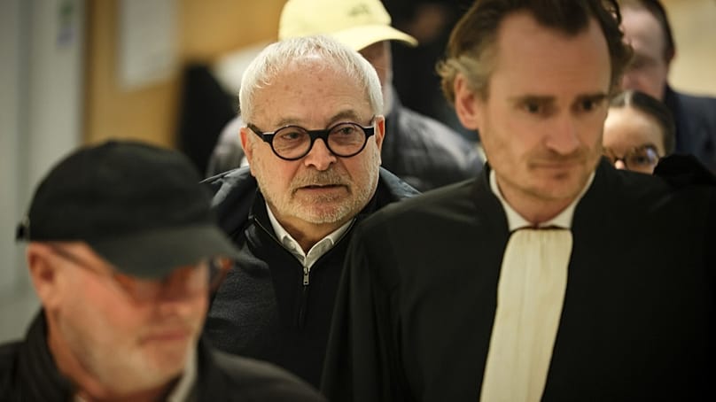 French former senator Joel Guerriau, center, and his lawyer Henri Carpentier, arrive at the courtroom, in Paris, Monday, Jan. 26, 2026. 