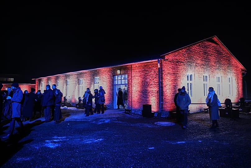 People leave a building after a ceremony marking the anniversary of the liberation of the Auschwitz Nazi death camp museum in Oświęcim, 27 January, 2026