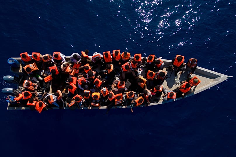 Migrants from Eritrea, Libya and Sudan sail in a wooden boat before being assisted by aid workers of the Spanish NGO Open Arms in the Mediterranean Sea, 17 June, 2023