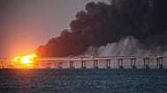 Flames and smoke rise from the Kerch Bridge connecting the Russian mainland and the Crimean peninsula, 8 October, 2022