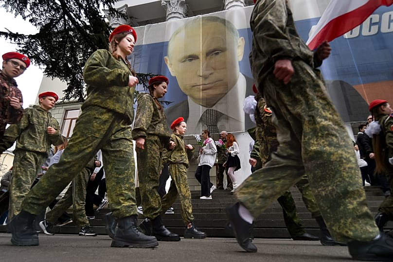 Youths mark the ninth anniversary of the annexation of Crimea from Ukraine in Yalta, 17 March, 2023