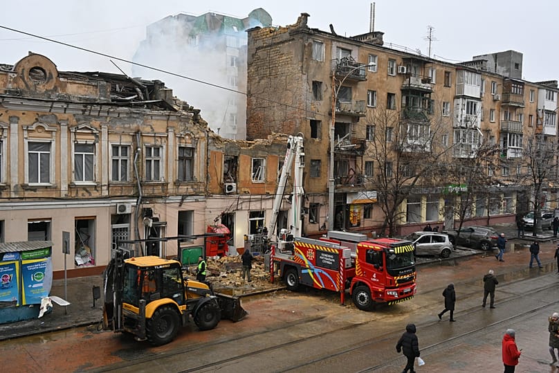 Rescue workers clear the rubble of a residential building which was heavily damaged after a Russian strike in Odesa, Ukraine, Tuesday, Jan. 27, 2026.