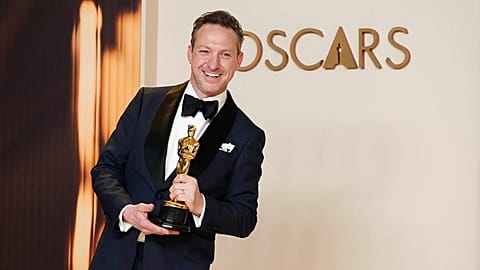 FILE: British cinematographer Lol Crawley with his Academy Award for his work on 'The Brutalist', Los Angeles, Mar 2025 
