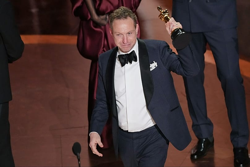 FILE: Lol Crawley accepts the best cinematography award for 'The Brutalist' during the Oscars on Sunday, March 2, 2025, at the Dolby Theatre in Los Angeles.