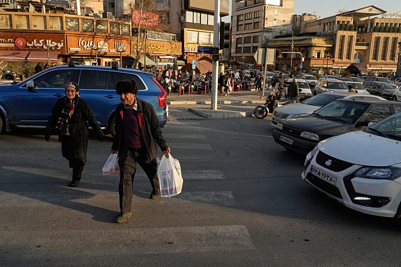 People walk at Tajrish Square in northern Tehran, 27 January, 2026