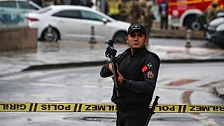 A member of Turkish security forces stands guard near a cordoned off area in Ankara, 1 October, 2023