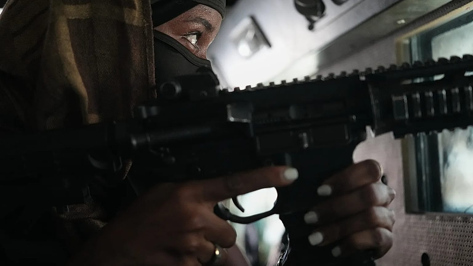 A police officer in an armoured vehicle patrols a gang-controlled area of Port-au-Prince, 19 January, 2026