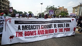 Police disperse protesters demanding compensation following mass eviction