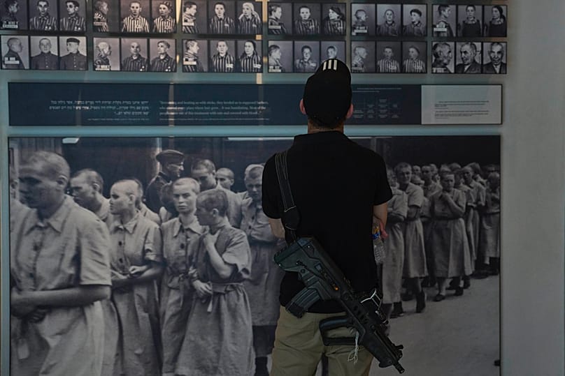 An Israeli soldier look at exhibits at the Yad Vashem Holocaust memorial in Jerusalem, ahead of the International Holocaust Remembrance Day, Sunday, Jan. 25, 2026