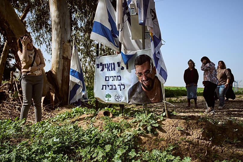 People visit a memorial site where Hamas militants killed Ran Gvili in Kibbutz Alumim, 27 January, 2026