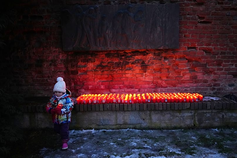 A young girl holds a candle during the International Holocaust Remembrance Day in the Czech Republic, 27 January, 2026