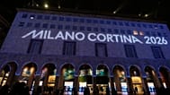 Olympic rings are projected on the facade of a building in front of the Duomo gothic cathedral, in Milan, Italy, Wednesday, Jan. 28, 2026. (AP Photo/Luca Bruno)