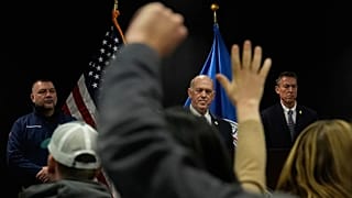Members of the media raise their hands to ask questions as White House border czar Tom Homan holds a news conference in Minneapolis, 29 January 2026