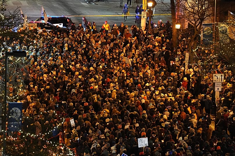 People gather during a vigil where Alex Pretti was shot and killed by federal immigration enforcement in Minneapolis, 28 January, 2026